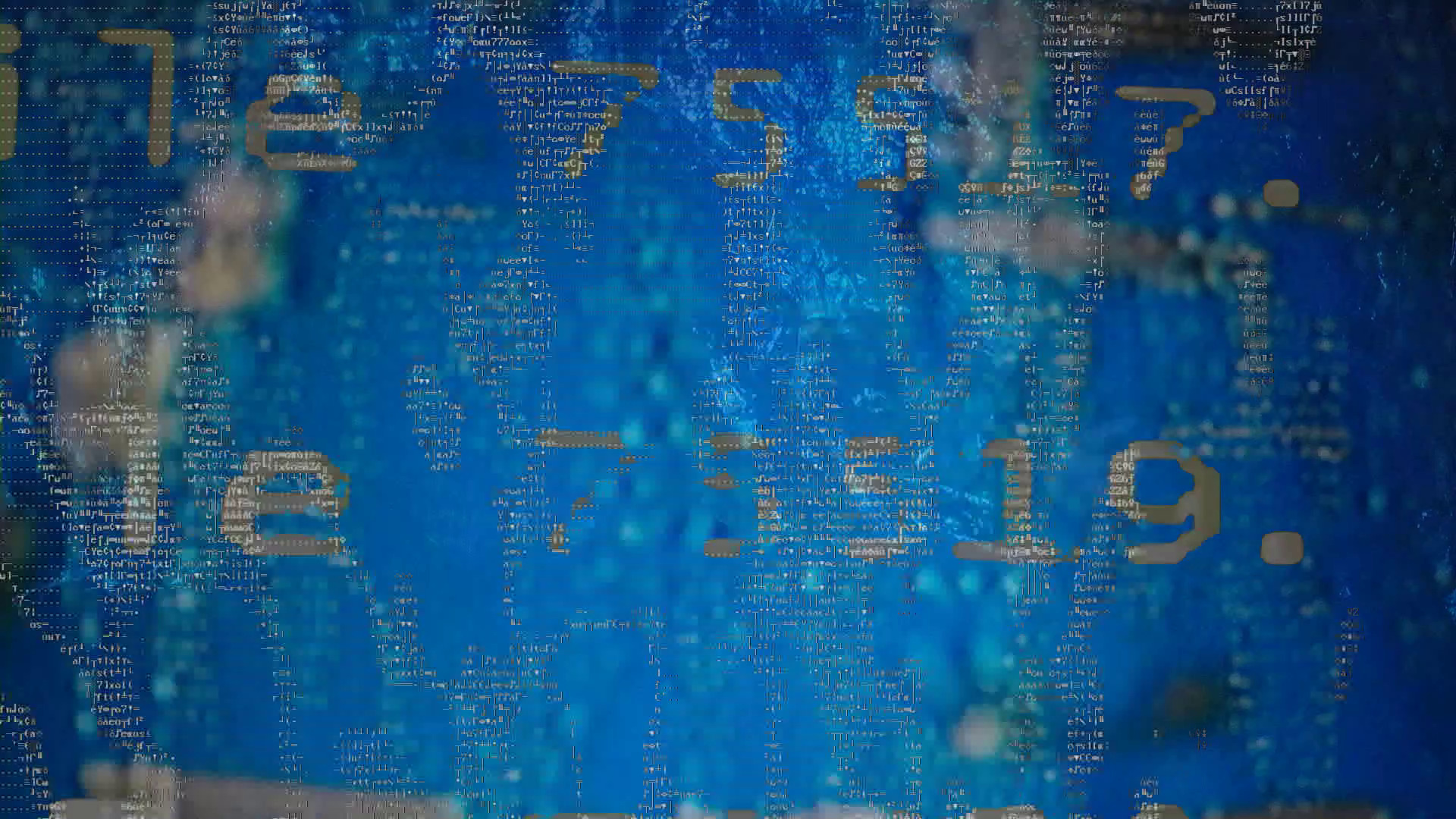 Performer at table with gear, engulfed in green and yellow projected visuals by !ZeuqsaV! — Radio Axiom live session